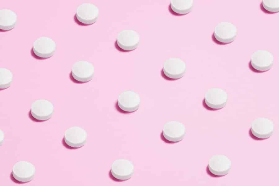 Five Life-Changing Perks Of Drug Rehab White Round Capsule On Pink Background Close-Up Photography